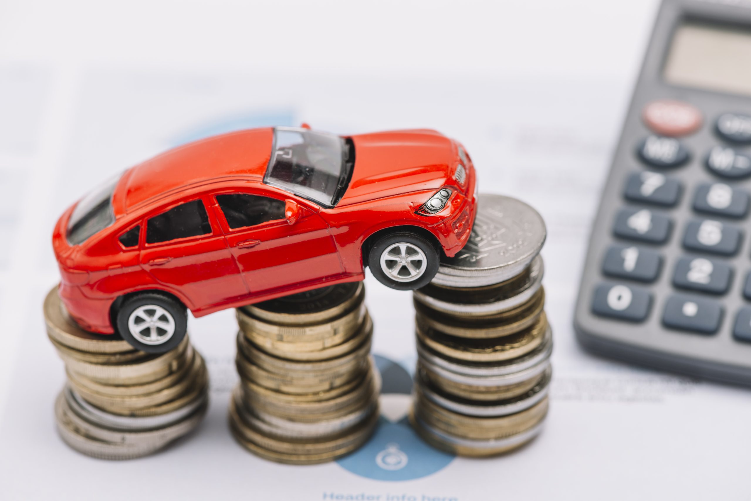 Kredyt samochodowy 1 toy car balancing increasing coin stack scaled